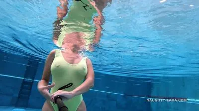 Transparent wet swimwear in public pool